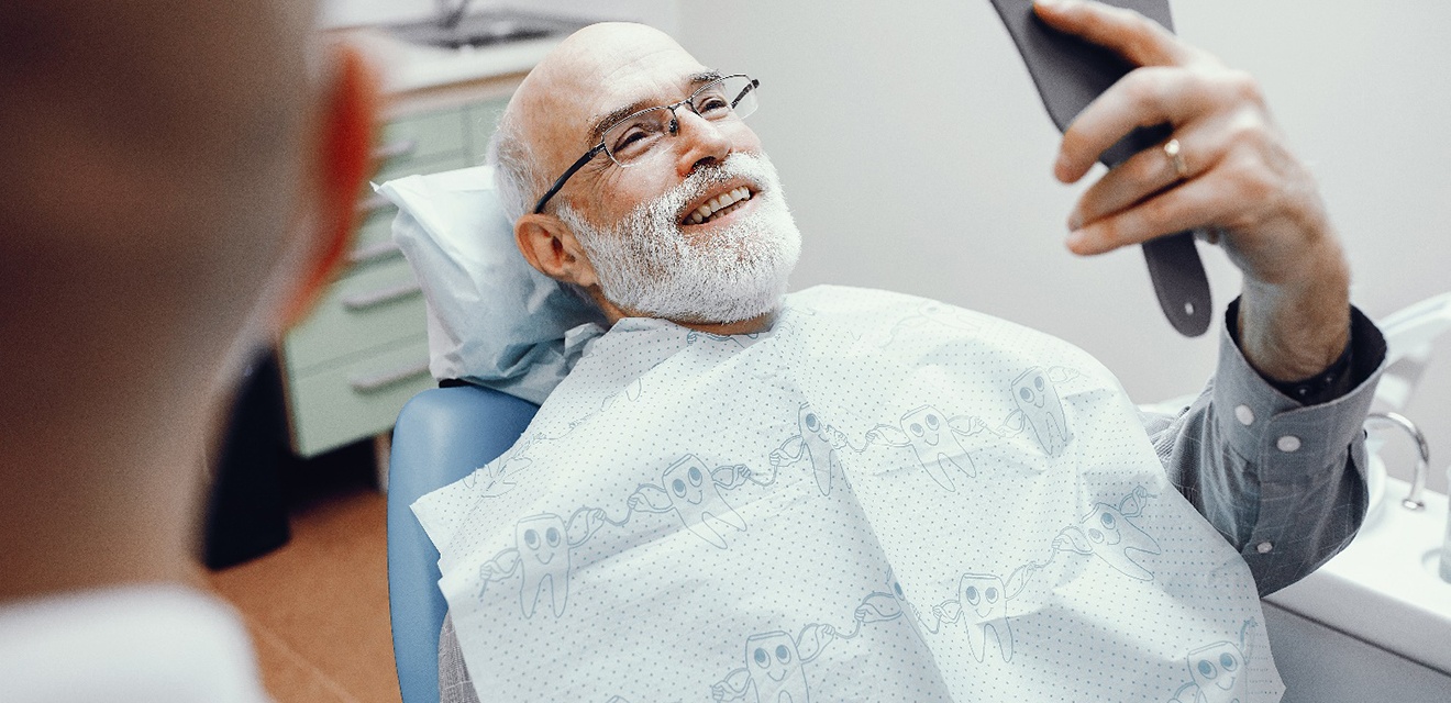 Man smiling at the dentist in Denver