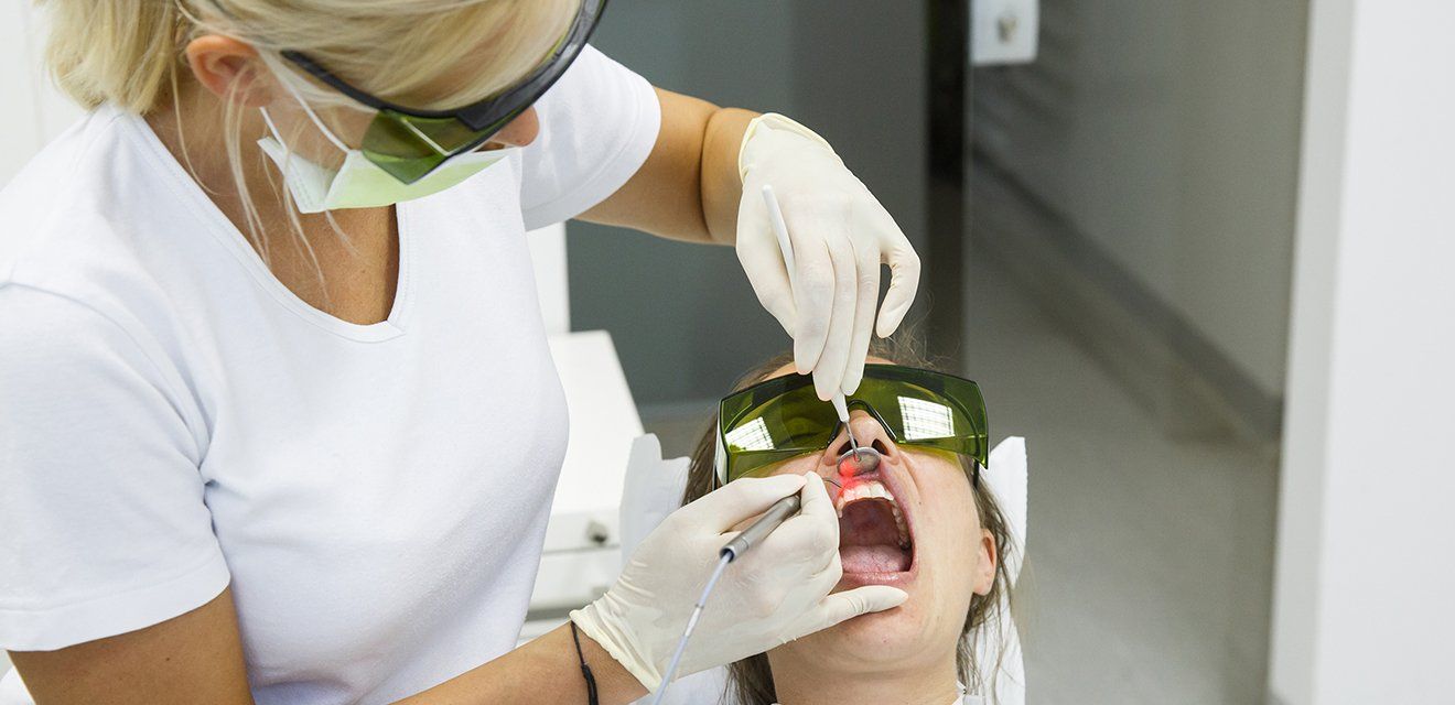 dentist using laser