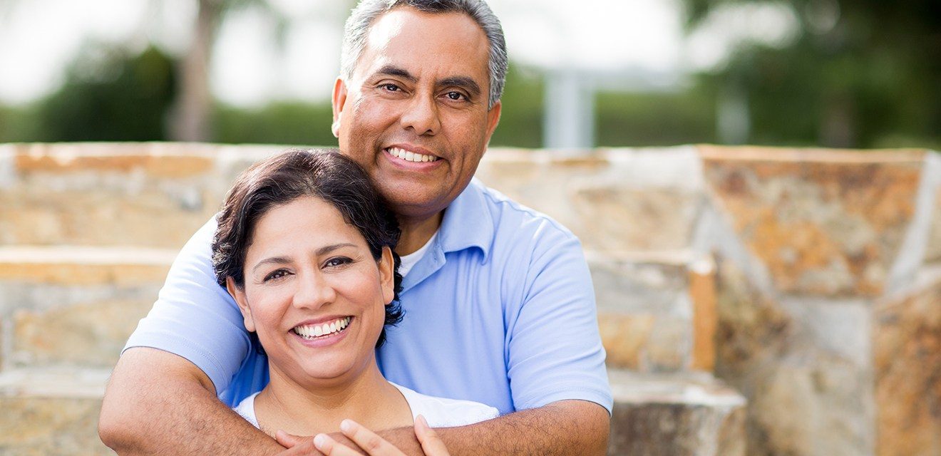 husband hugging wife from behind