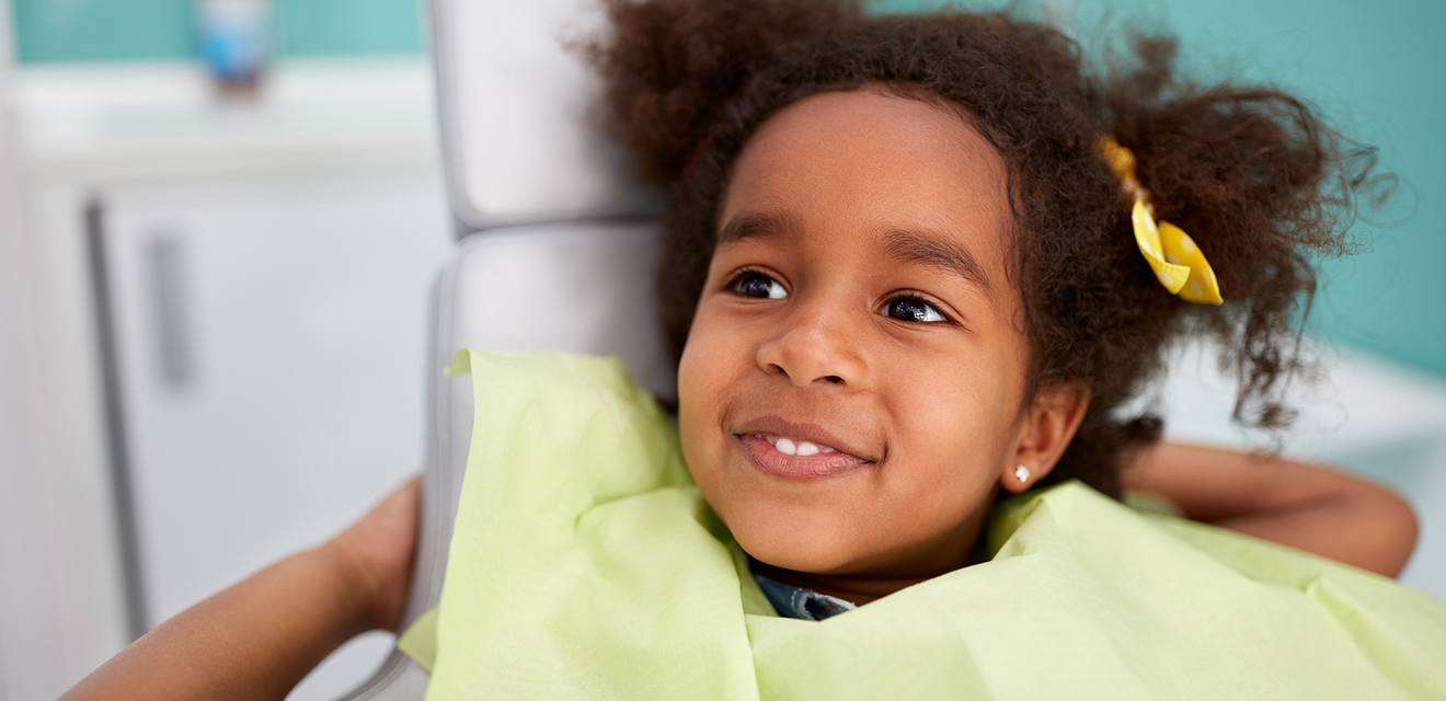 little girl smiling at dentist