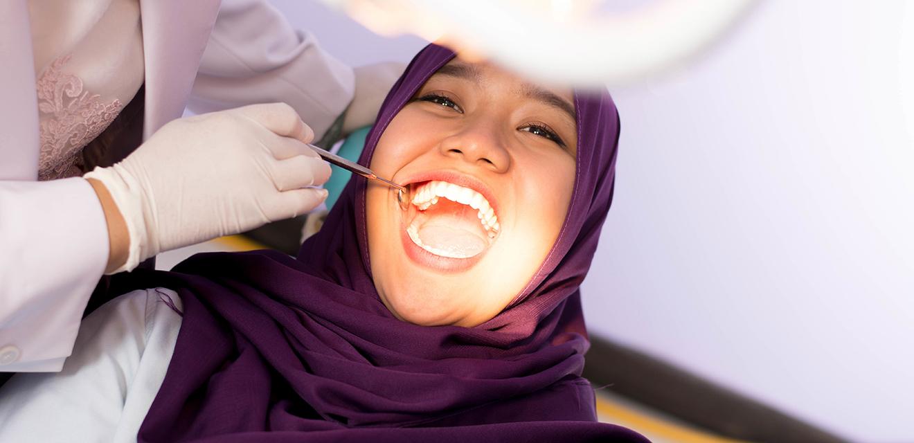 woman having dental evaluation
