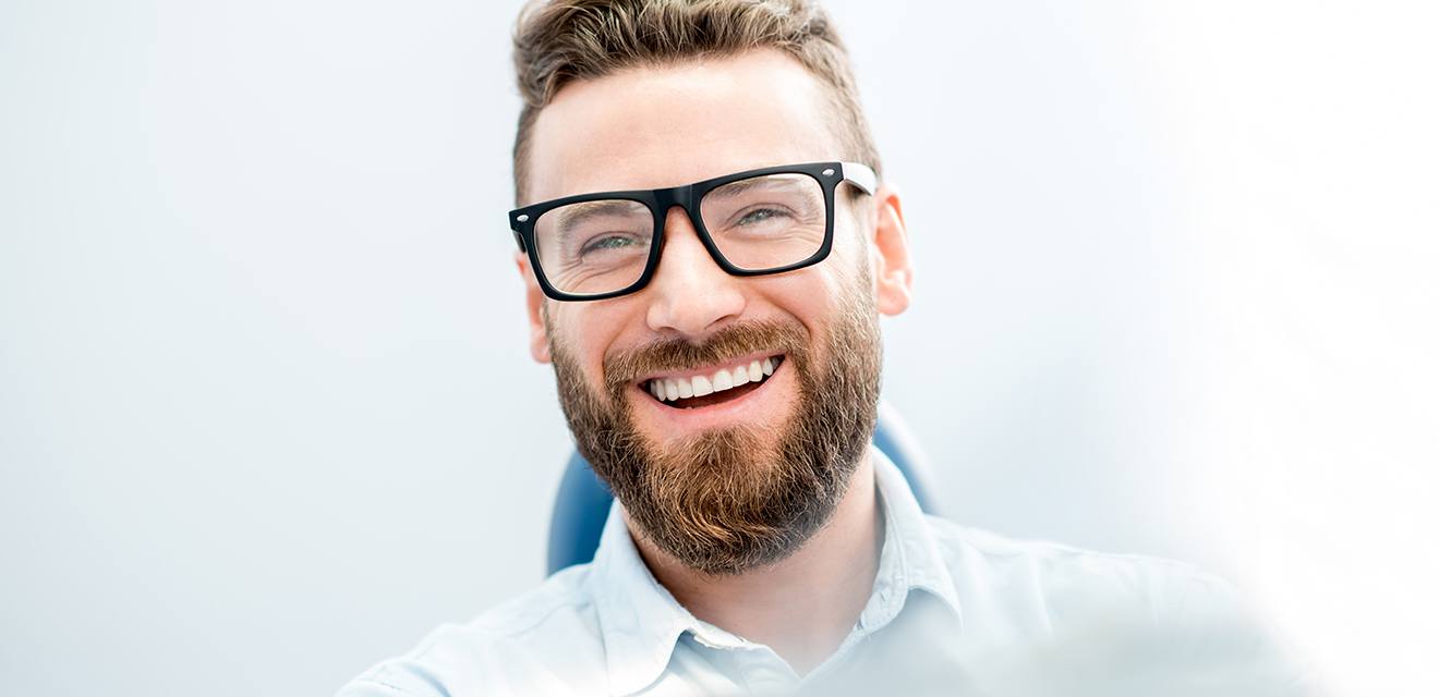 man with glasses and beard smiling