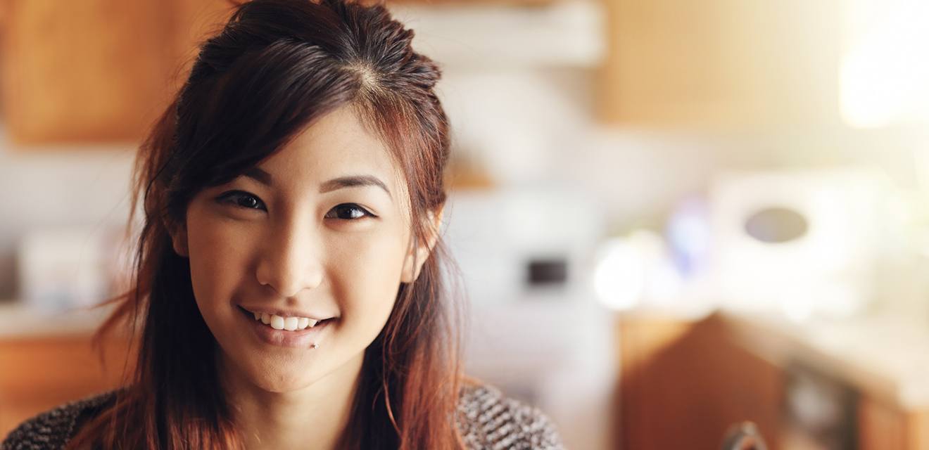 woman smiling after understanding the cost of cosmetic dentistry in Denver