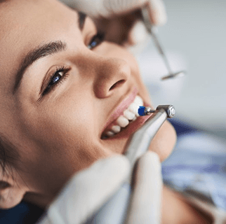 Dentist pointing to X-ray on computer screen