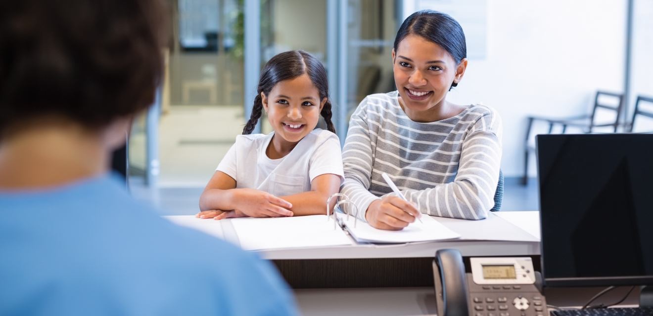 mother and daughter at desk