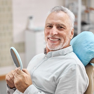 Man with dental implants in Denver