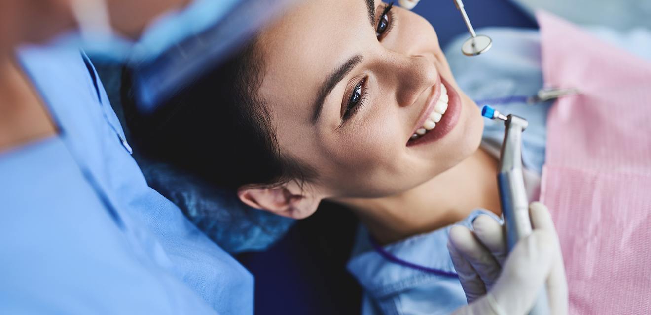 girl having dental cleaning done