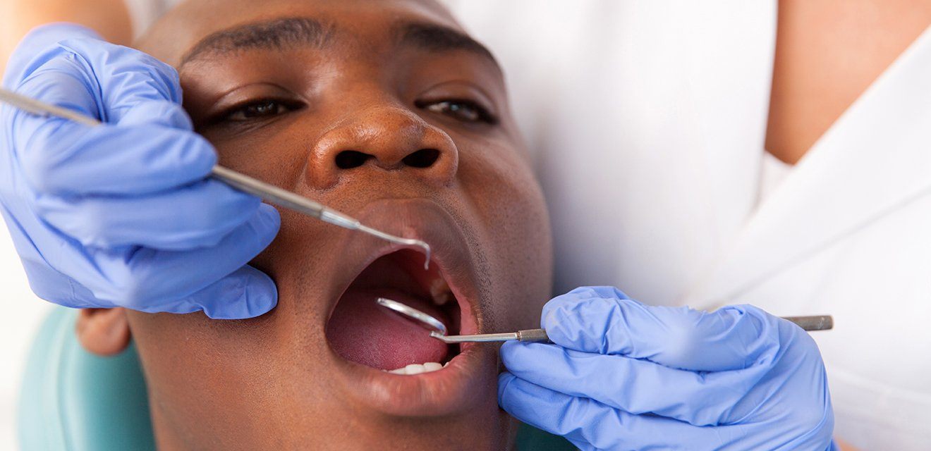 man getting oral cancer screening