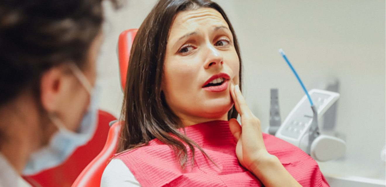 Woman at the dentist with a toothache